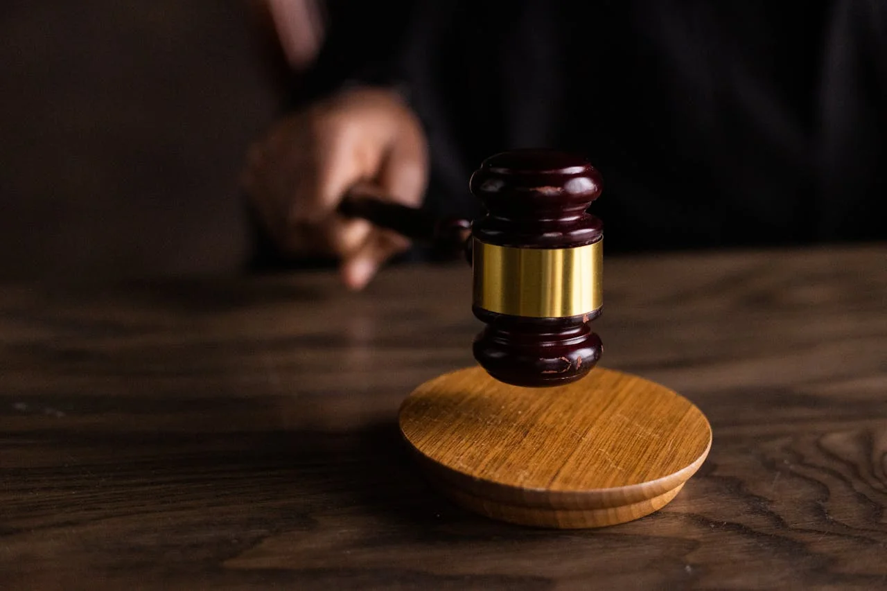 A judge's gavel representing the high-stakes confidentiality requirements of legal practice